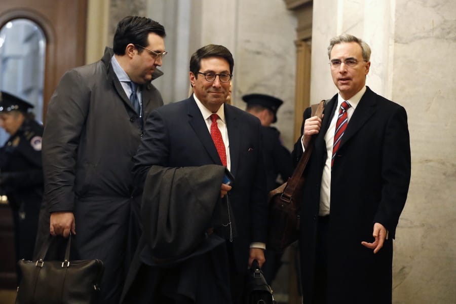 President Donald Trump&#039;s personal attorney Jay Sekulow, center, stands with his son, Jordan Sekulow, left, and White House Counsel Pat Cipollone, while arriving at the Capitol in Washington during the impeachment trial of President Donald Trump on charges of abuse of power and obstruction of Congress, Saturday, Jan. 25, 2020.