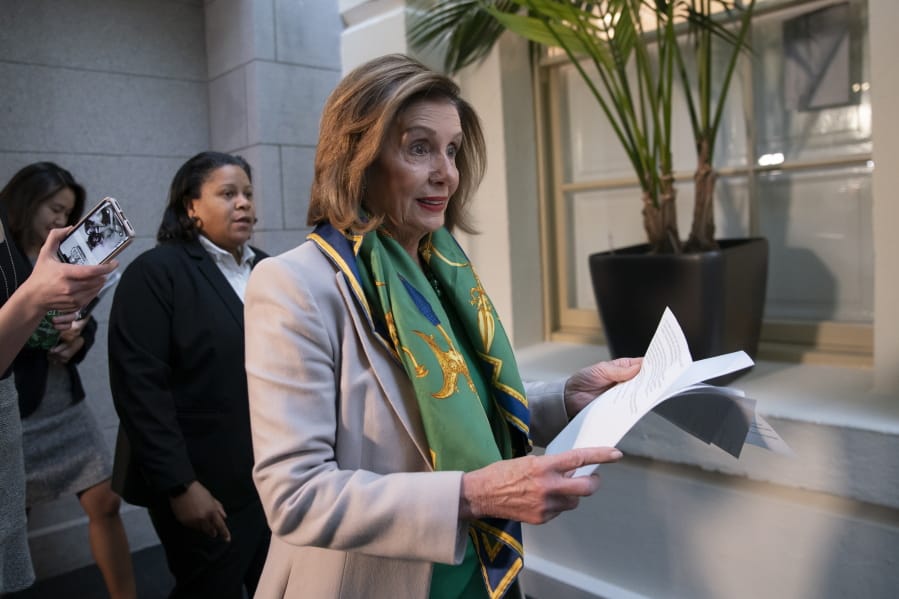 Speaker of the House Nancy Pelosi, D-Calif., arrives to meet with the Democratic Caucus at the Capitol in Washington, Tuesday, Jan. 14, 2020. Pelosi, who has not yet relayed the articles of impeachment to the Senate for the trial of President Donald Trump, has said she will discuss her next steps in that delayed process during her meeting today with fellow Democrats. Trump was impeached by the Democratic-led House last month on charges of abuse of power over pushing Ukraine to investigate Democratic rival Joe Biden and obstruction of Congress in the probe. (AP Photo/J.