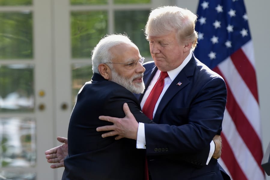 FILE - In this June 26, 2017, file photo, President Donald Trump and Indian Prime Minister Narendra Modi hug while making statements in the Rose Garden of the White House in Washington. Officials in the U.S. and Indian governments say President Donald Trump is in the early stages of planning what would be his first visit to India, the world&#039;s largest democracy.