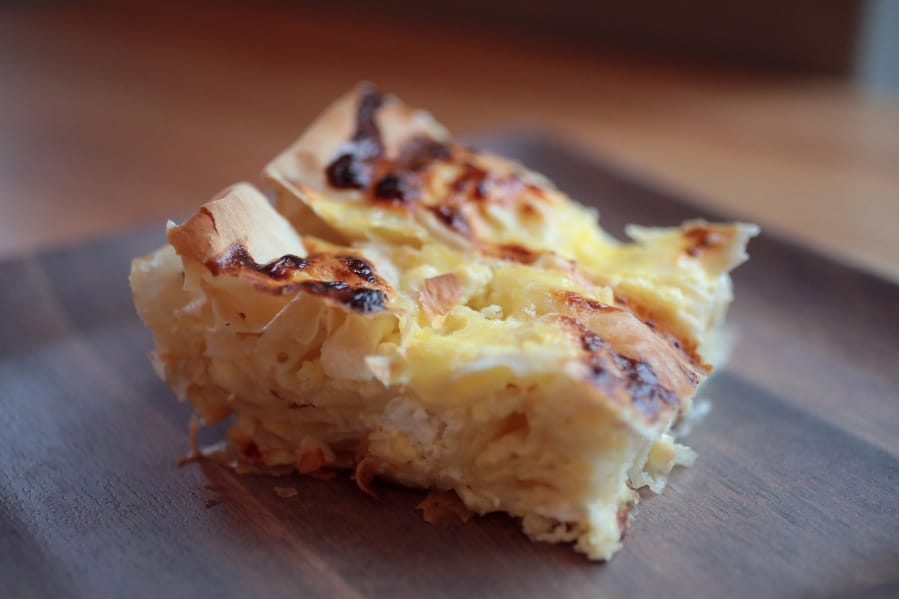 A slice of Balkan cheese pie made by Monica Obradovic, on December 9, 2019. (Cristina M. Fletes/St.