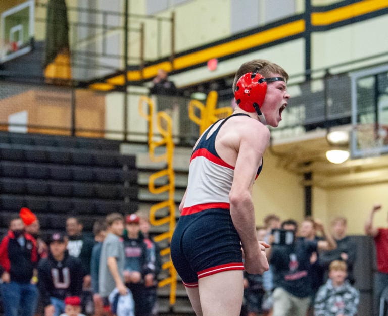 Camas' Porter Craig (106) celebrates his pin of Union's Spencer Needham in the 4A Sub-Regional Championship match on Saturday at Hudson's Bay High School.