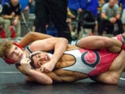 Union&#039;s Ryan Esperto (126 pounds) picks up near fall points against Camas&#039; Devin Padilla in the 4A Sub-Regional Championship match on Saturday at Hudson&#039;s Bay High School.