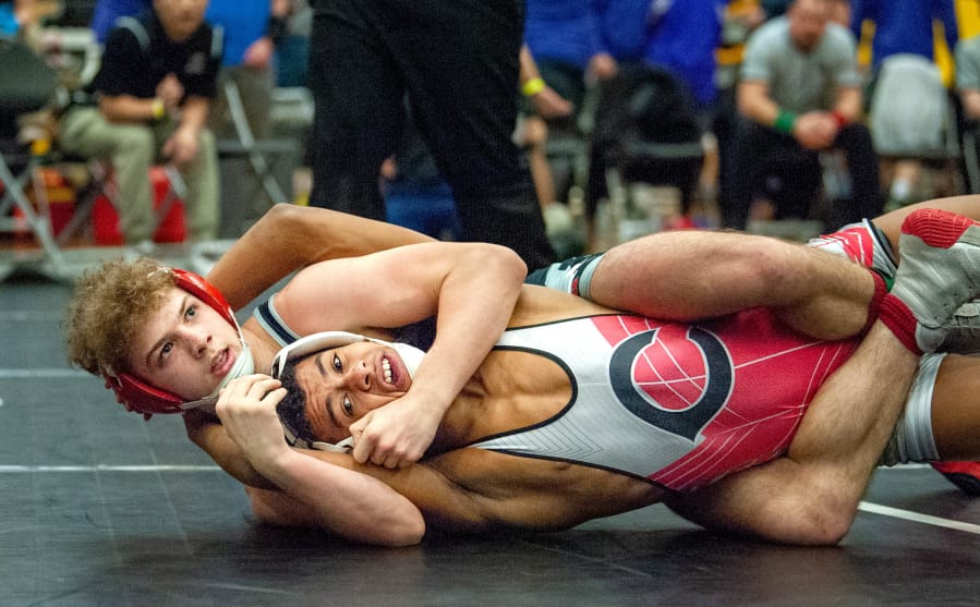Union&#039;s Ryan Esperto (126 pounds) picks up near fall points against Camas&#039; Devin Padilla in the 4A Sub-Regional Championship match on Saturday at Hudson&#039;s Bay High School.