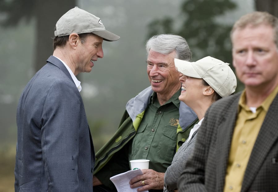 Former Congressman Don Bonker, center, and his daughter, Dawn Elyse Bonker, talk with Sen. Ron Wyden of Oregon in August 2011 at a dedication ceremony for the Nancy Russell Overlook at Cape Horn in the Columbia River Gorge. Bonker cites former U.S. senator and Washington Gov. Dan Evans, a Republican, as someone who showed political leadership and courage with his support of the Columbia River Gorge National Scenic Area Act.