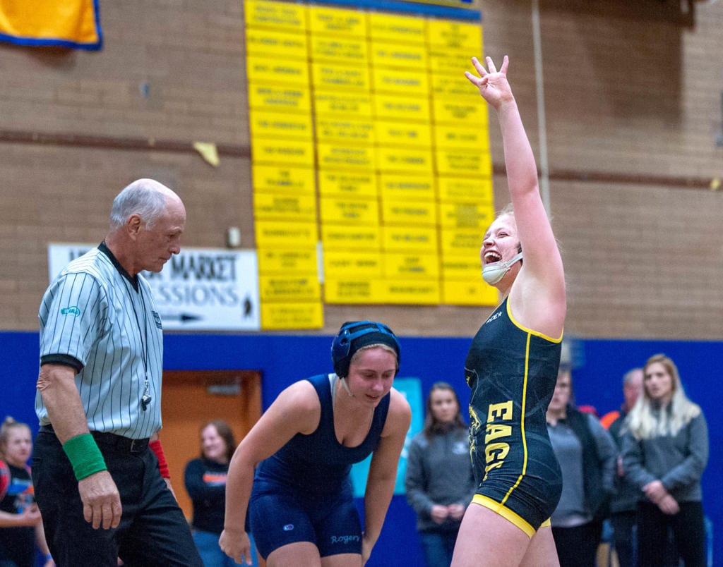 Hudson's Bay's Allison Blaine celebrates her win over Rogers' Kimber Jackson in their 135-pound championship match at the WIAA Girls Region 3 Tournament on Saturday at Kelso.