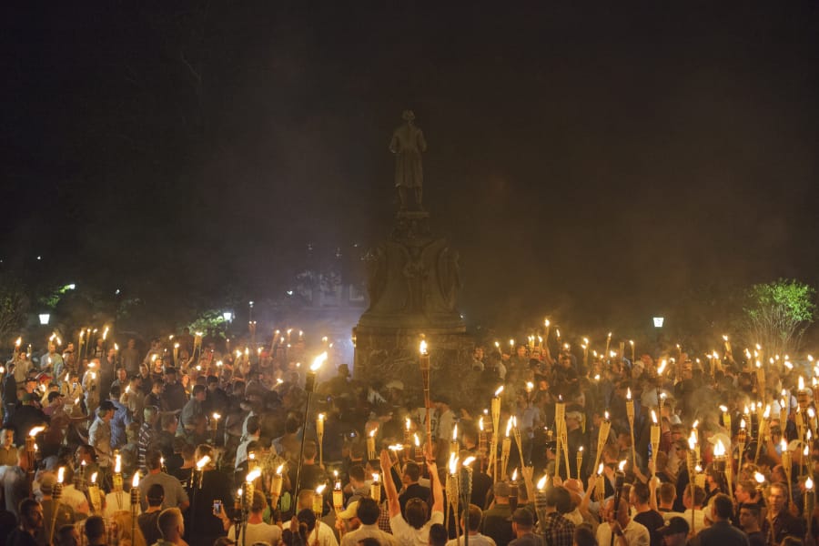 Neo Nazis, Alt-Right, and White Supremacists encircle counter protestors at the base of a statue of Thomas Jefferson after marching through the University of Virginia campus with torches in Charlottesville, Va., USA on August 11, 2017 (Shay Horse/NurPhoto via Getty Images/TNS)