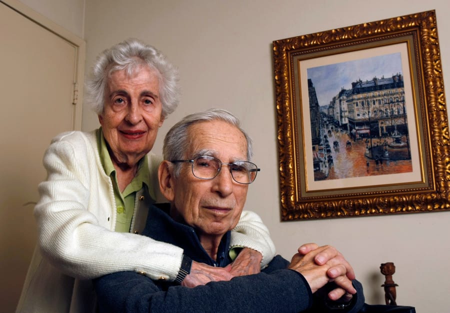 Beverly Cassirer and her husband, Claude, are shown in 2010 in La Mesa, Calif., with a copy of a painting by Impressionist Camille Pissarro.