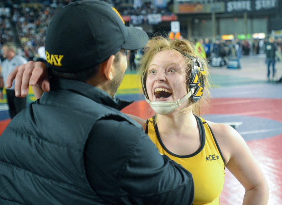 Hudson&#039;s Bay&#039;s Allison Blaine celebrates her third state title, a 15-4 decision victory in the 135-pound girls finals.