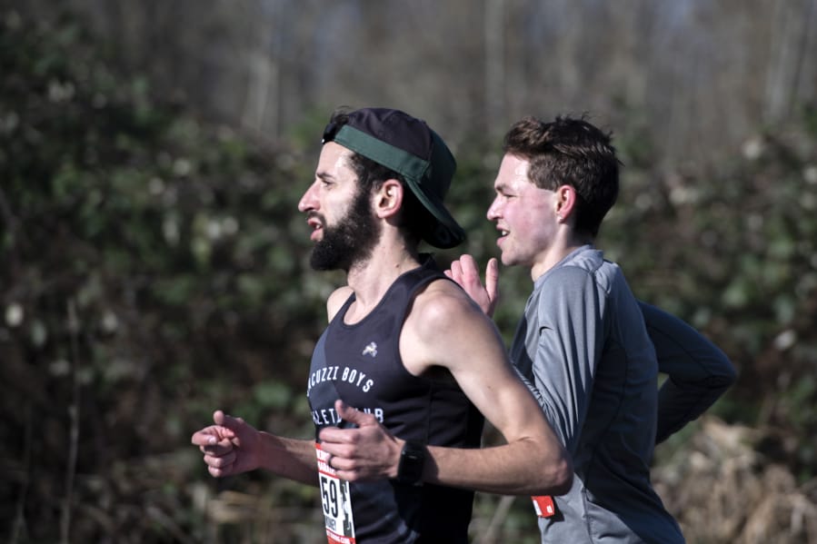 Karim Shakalia, left, and Zach Dulabon lead all runners during the Vancouver Lake Half Marathon.