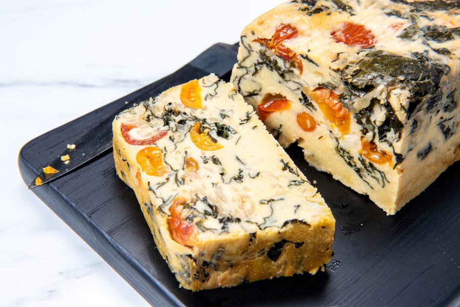 A mosaic of kale and tomatoes lace this chickpea frittata. Prop styling by Kate Parisian.