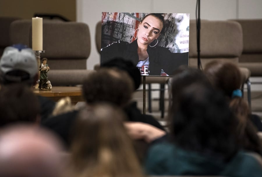 A photo of Nikki Kuhnhausen is placed at the front of the room during a vigil Dec. 20, 2019, at the Vancouver United Church of Christ in Hazel Dell.