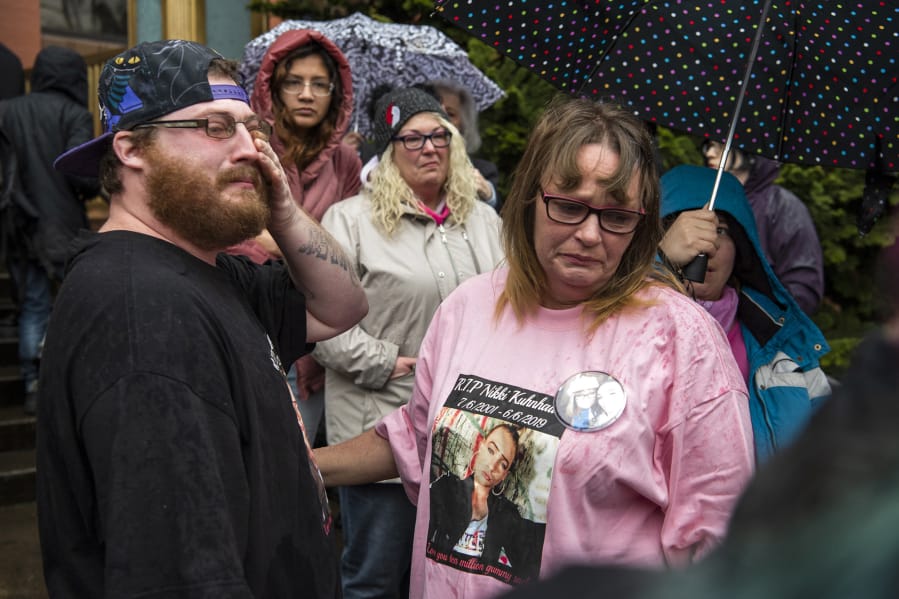 Jeremiah Anderson, left, and his aunt Lisa Woods become emotional after they hug one another outside the Clark County Courthouse the morning of Jan. 2. Superior Court Judge David Gregerson had set $750,000 bail for David Y. Bogdanov in the slaying of Woods&#039; daughter, transgender Vancouver teen Nikki Kuhnhausen.