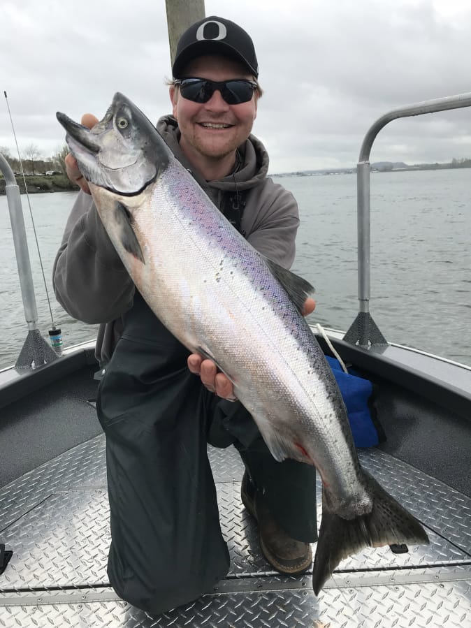 Casey Finn of Beaverton, Ore., shows off a nice Columbia River spring Chinook caught while fishing with guide Bob Rees last season.