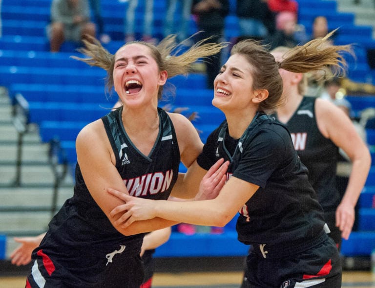 Union's Lolo Weatherspoon, left, and Mason Oberg celebrate their 48-47 win over Todd Beamer in a 4A State Regional on Friday at Auburn Mountainview High School.