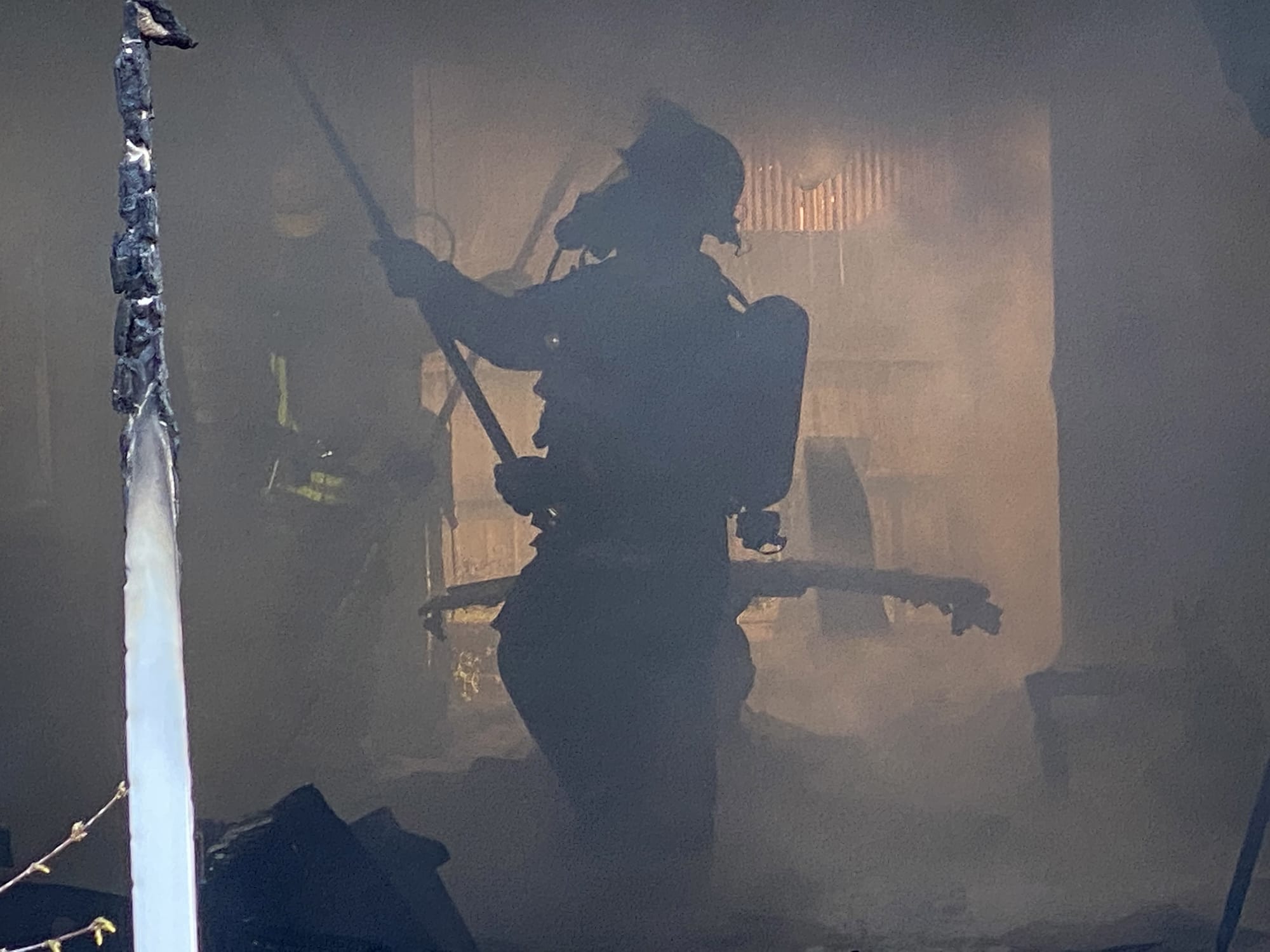 A firefighter responds to a residential fire at 508 N.E. 127th Street on Friday, Feb. 21, 2020.