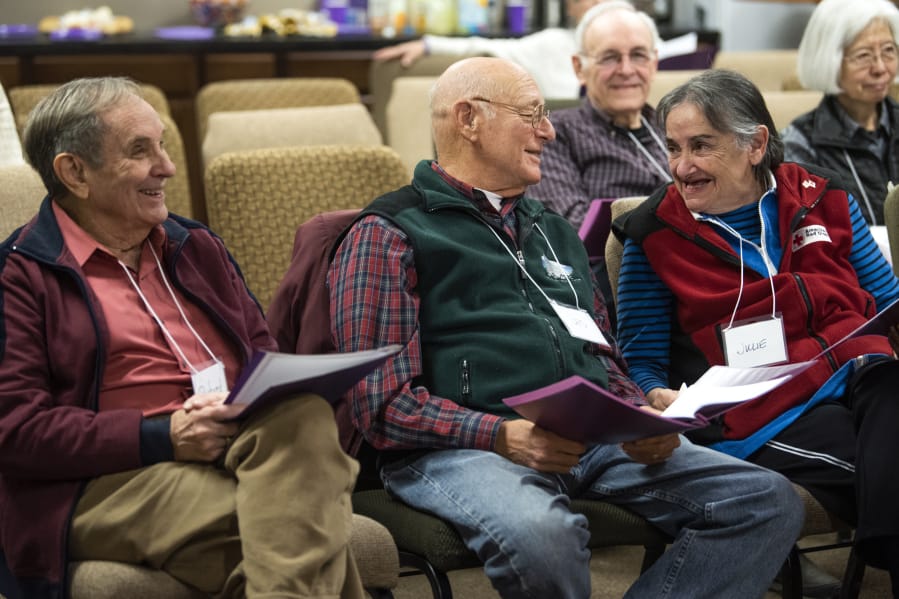 Richard Sauter, left, Les Burger and his wife Julie Burger chat during a Sing Here Now choir practice at Mannahouse Church in Vancouver. Sing Here Now is Clark County&#039;s only Alzheimer&#039;s Choir. It&#039;s run by the Alzheimer&#039;s Association Oregon &amp; Southwest Washington Chapter.