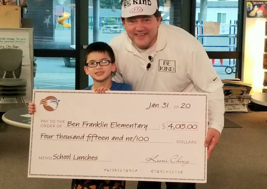 NORTHWEST: Benjamin Franklin Elementary School second-grader Keoni Ching raised $4,015 to help pay off his classmates&#039; outstanding balances on their lunch accounts. He presented the check to Principal Woody Howard on Jan.