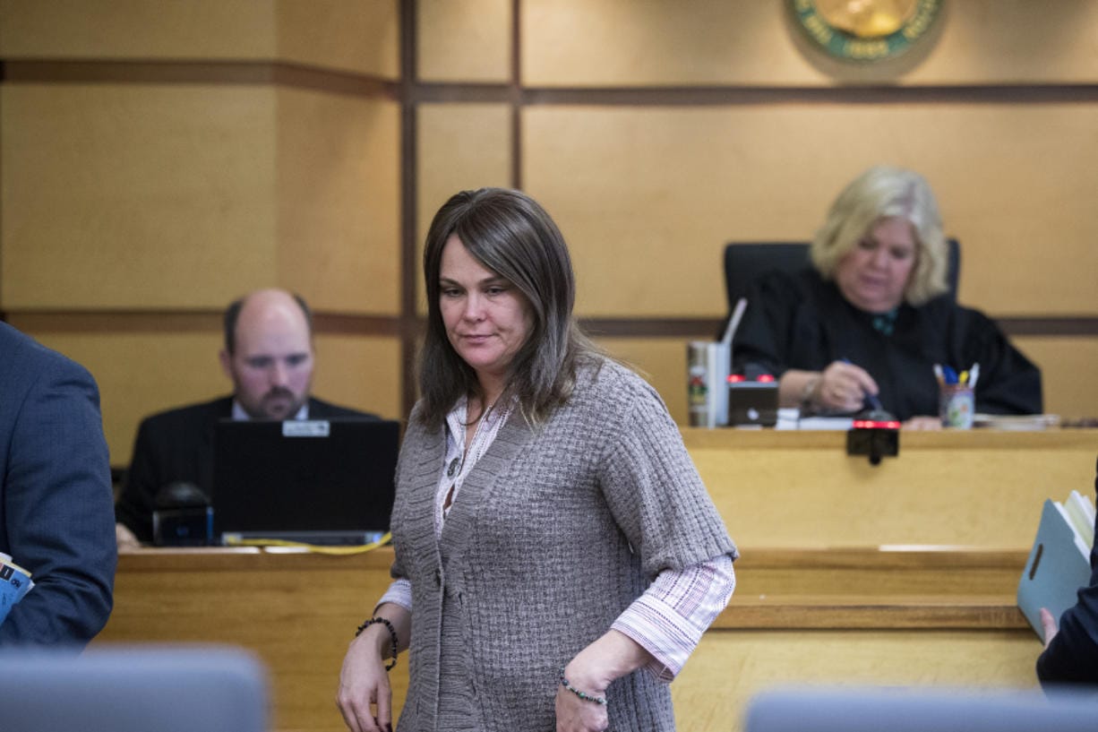 Sadie R. Pritchard, a former associate principal at Evergreen High School who resigned following allegations she had sex with a teenage student at the school, begins exiting the courtroom after entering two guilty pleas Tuesday afternoon in Clark County Superior Court.