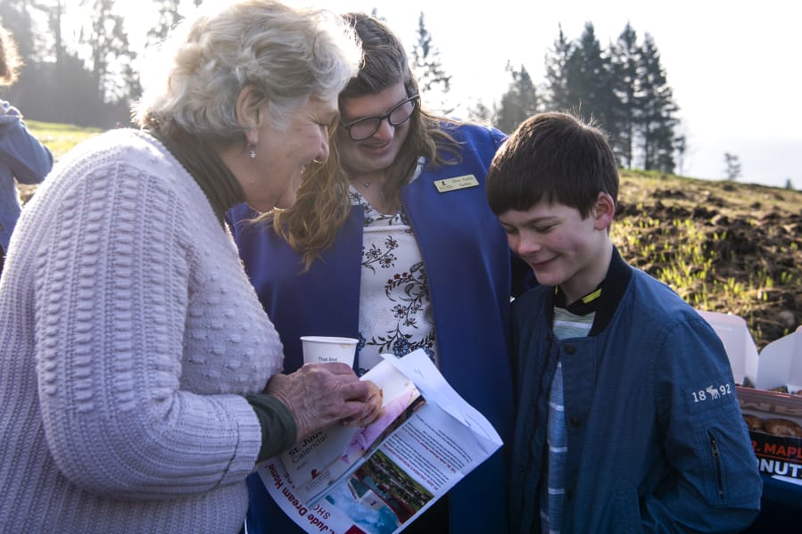 Washougal Mayor Molly Coston, left, talks with DeeAnna Janku, development representative for St. Jude Children&#039;s Research Hospital, and Janku&#039;s son Gideon during the groundbreaking for a St. Jude Dream Home in Washougal. Gideon was diagnosed with a rare form of melanoma and does checkups with St. Jude in Tennessee. The house will be built without cost to St. Jude, but all proceeds from the sale will benefit the hospital. Gideon turns 10 on Saturday.