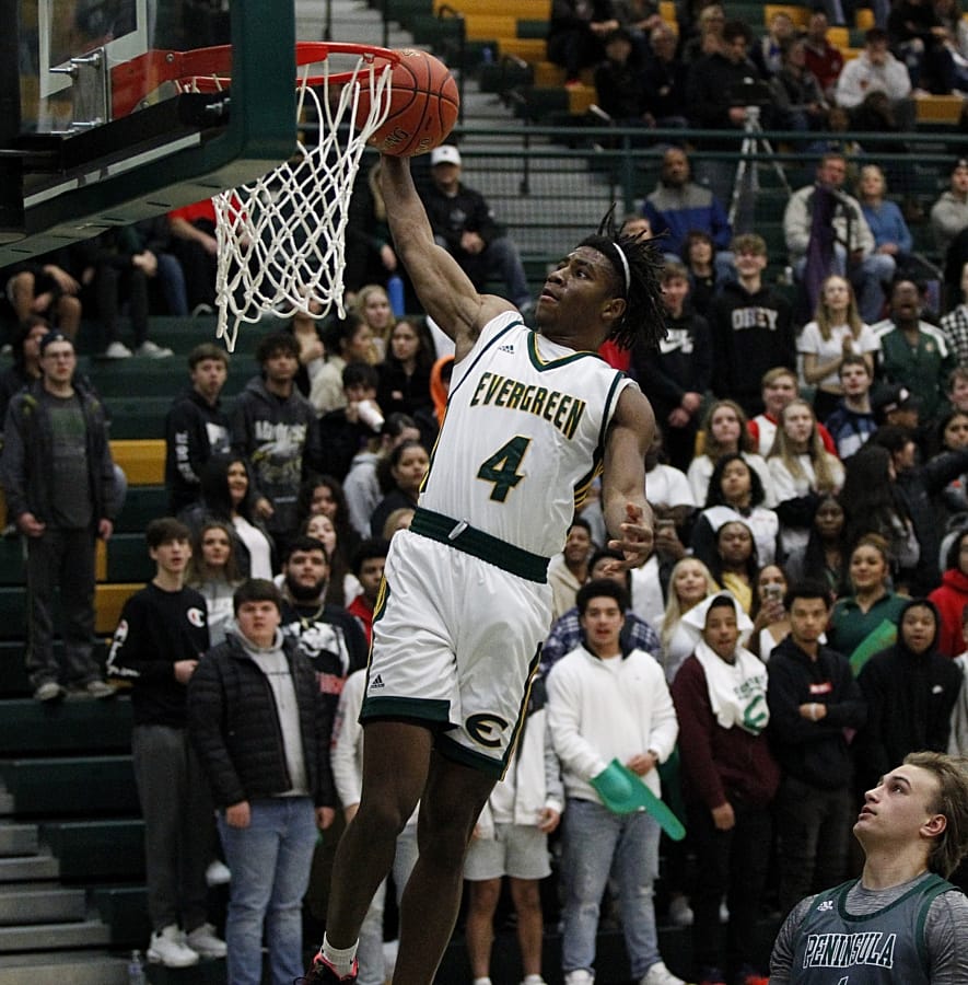 Evergreen&#039;s Zyell Griffin goes up for a dunk vs. Peninsula in a winner-to-state game in the 3A boys basketball bi-district tournament on Saturday night, Feb. 15, 2020.