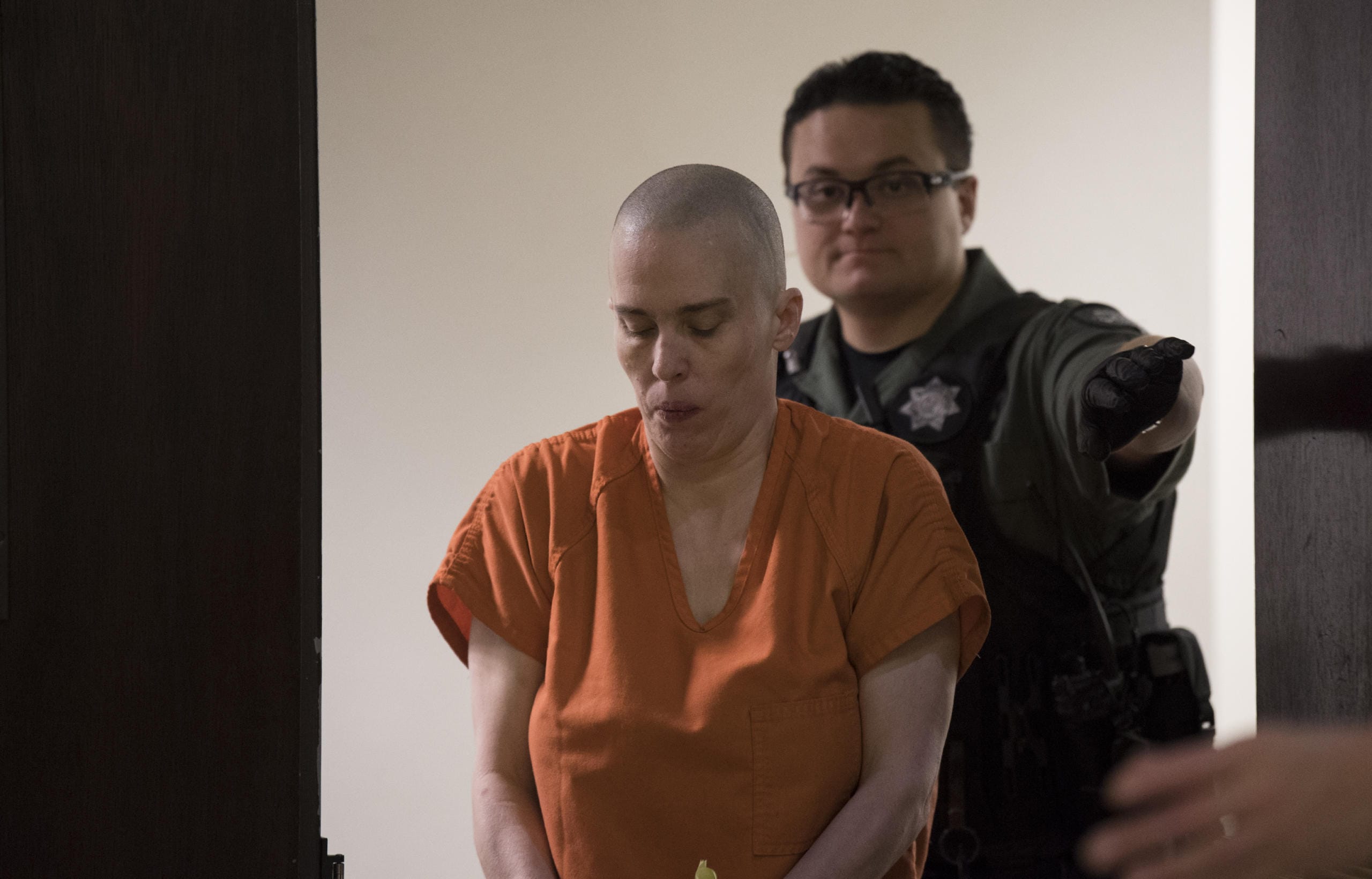 Rima L. McQuestion, 44, leaves the courtroom after appearing Thursday in Clark County Superior on suspicion of first-degree assault, a potential charge stemming from an alleged knife attack that left her sister hospitalized with life-threatening injuries.