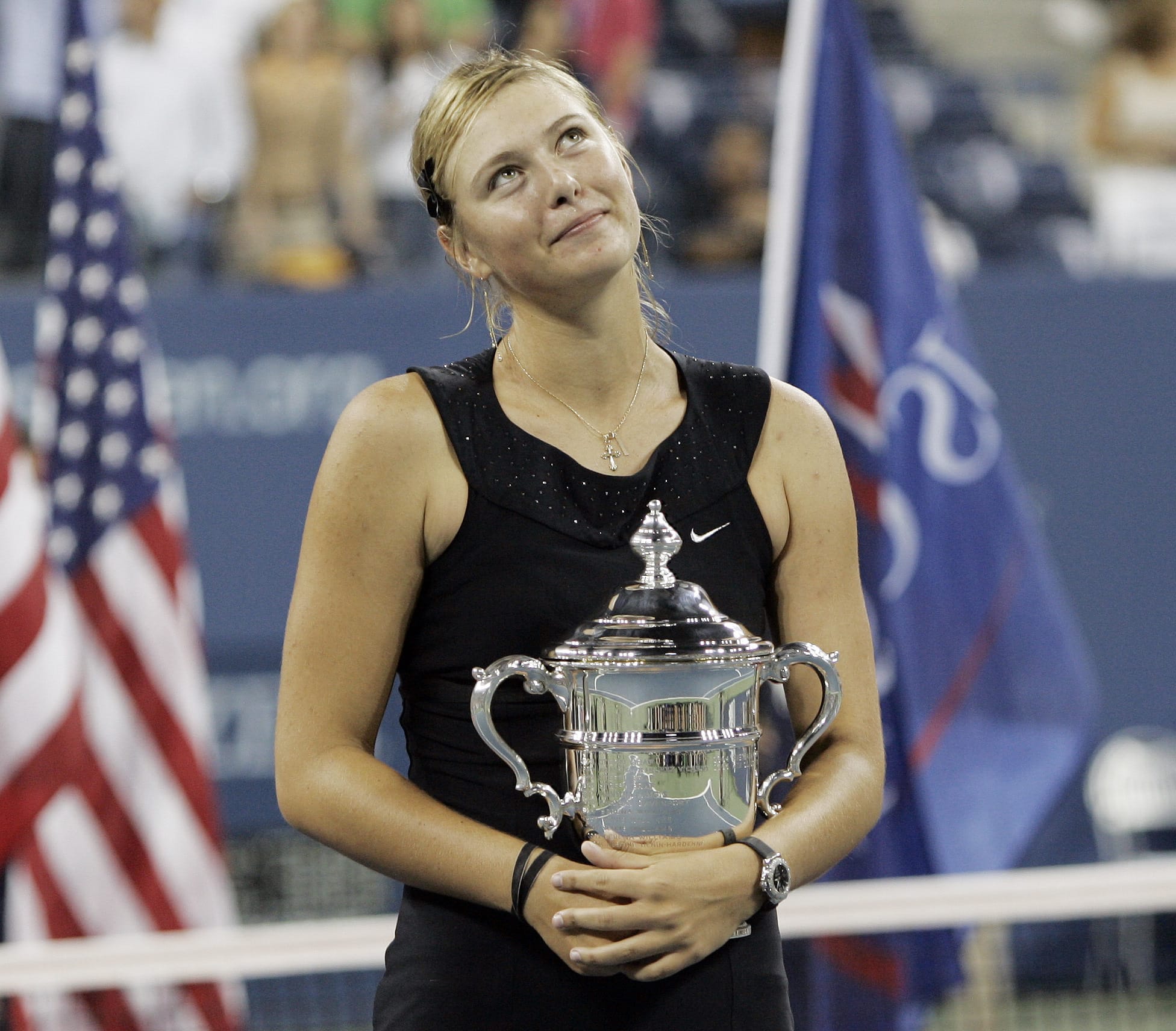 Maria Sharapova looks up to the crowd after winning the 2006 U.S. Open women's singles championship. Sharapova is retiring from professional tennis at the age of 32 after five Grand Slam titles. She has been dealing with shoulder problems for years.