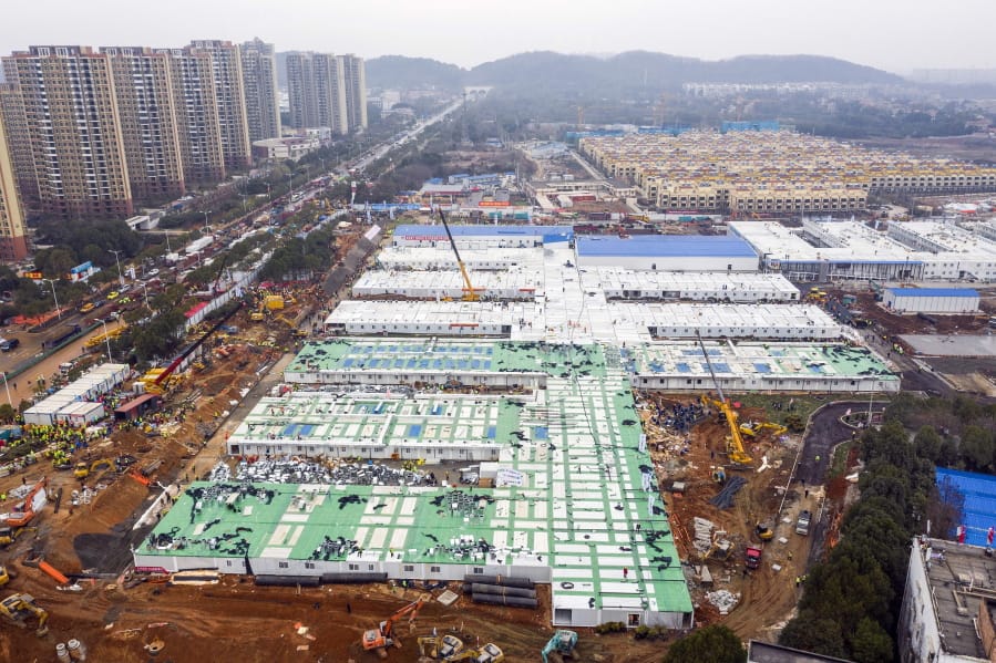 The Huoshenshan temporary field hospital under construction is seen as it nears completion in Wuhan in central China&#039;s Hubei Province, Sunday, Feb. 2, 2020. The Philippines on Sunday reported the first death from a new virus outside of China, where authorities delayed the opening of schools in the worst-hit province and tightened quarantine measures in a city that allow only one family member to venture out to buy supplies.
