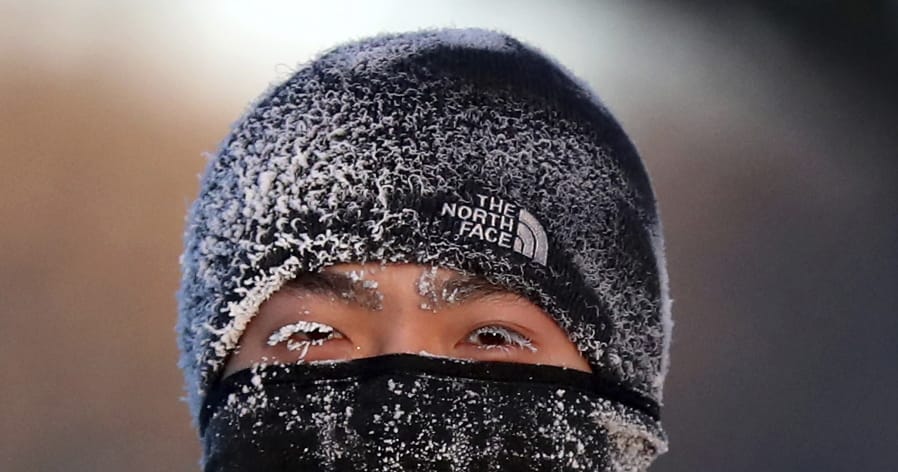A runner wears the cold on his face while running along West River Parkway hills Thursday, Feb. 13, 2020, near downtown Minneapolis, with temperatures hovering near minus 30 degrees Fahrenheit with wind chills.