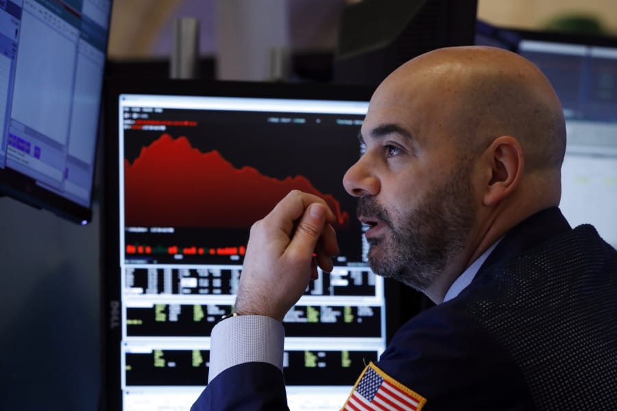 Trader Fred DeMarco works on the floor of the New York Stock Exchange, Friday, Feb. 28, 2020. Global stock markets are falling further on spreading virus fears.