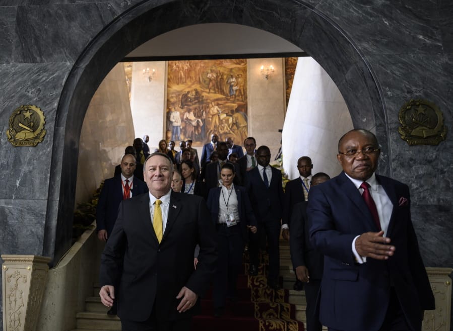 US Secretary of State Mike Pompeo, left, leaves with Angola Foreign Minister, Manuel Domingos Augusto after a press conference at the Ministry of Foreign Affairs in Luanda, Angola, Monday Feb. 17, 2020. Pompeo started his tour of Africa in Senegal, the first U.S. Cabinet official to visit in more than 18 months. He left Senegal Sunday to arrive in Angola and will then travel on to Ethiopia as the Trump administration tries to counter the growing interest of China, Russia and other global powers in Africa and its booming young population of more than 1.2 billion.