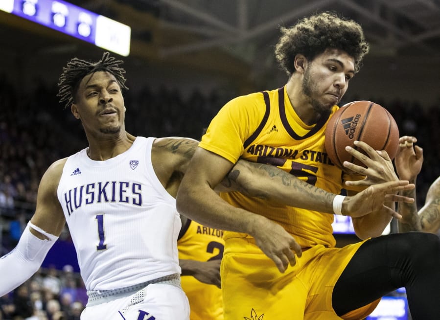Washington forward Nate Roberts (1) reaches for the ball against Arizona State forward Taeshon Cherry (35) on a rebound during an NCAA college basketball game Saturday, Feb. 1, 2020, in Seattle.