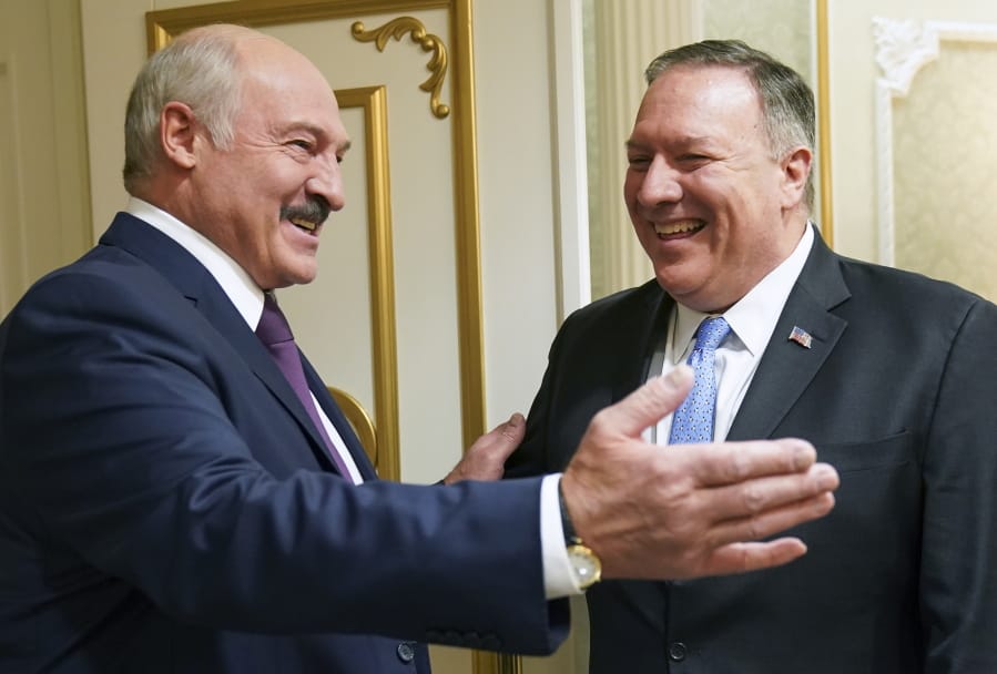 Belarusian President Alexander Lukashenko greets U.S. Secretary of State Mike Pompeo during a meeting in Minsk, Belarus, Saturday, Feb. 1, 2020.