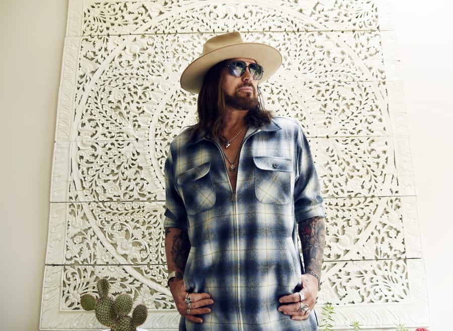 CORRECTS NAME OF THREE-SONG EP TO &quot;THE SINGIN&#039; HILLS SESSIONS VOL. 1 SUNSET&quot; -  Singer-songwriter Billy Ray Cyrus poses for a portrait at his home in Los Angeles on Thursday, Jan. 30, 2020. The Kentucky-born singer won his first Grammy this year for his collaboration with rapper Lil Nas X on &quot;Old Town Road.&quot; He&#039;s releasing a three-song EP on Friday,  &quot;The Singin&#039; Hills Sessions Vol.