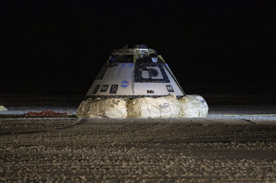 FILE - This Sunday, Dec. 22, 2019 file photo shows the Boeing Starliner spacecraft after it landed in White Sands, N.M. On Friday, Feb. 28, 2020, Boeing acknowledged it failed to conduct full and adequate software tests before the botched space debut of its astronaut capsule late last year.