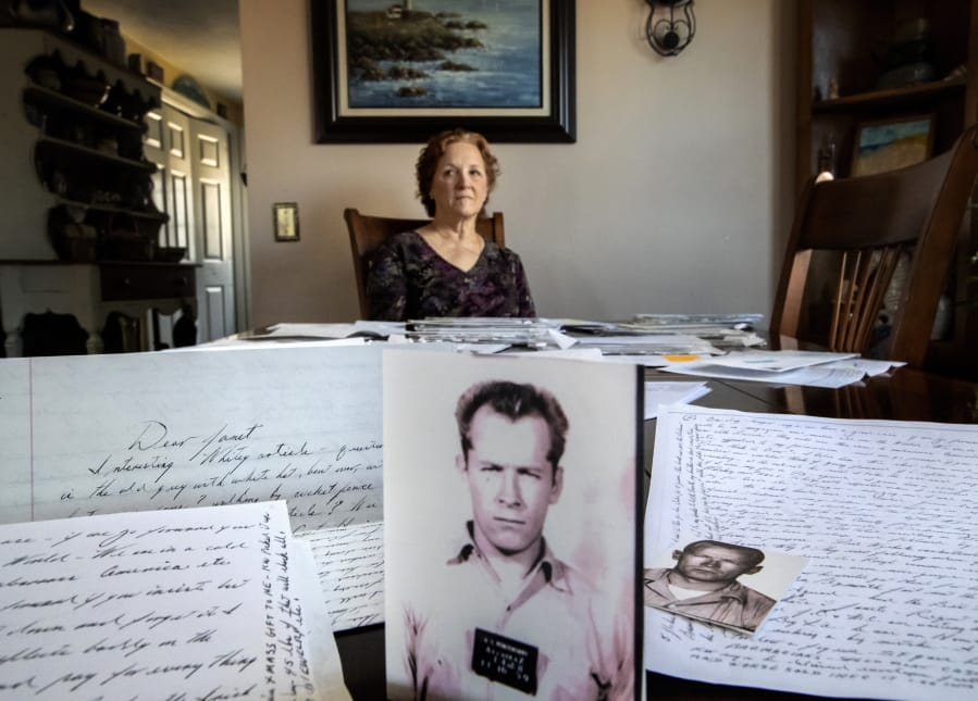 Janet Uhlar sits at her dining room table Jan. 31 in Eastham, Mass., with an arrangement of letters and pictures she received through her correspondence with imprisoned organized crime boss James &quot;Whitey&quot; Bulger.