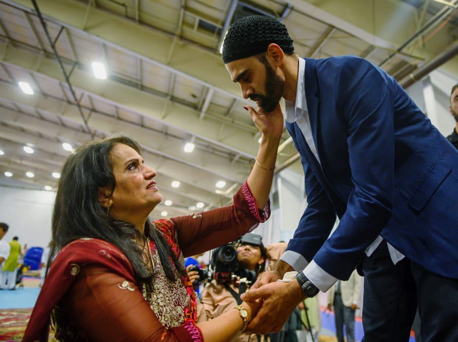 FILE - In this Aug. 11, 2019, file photo, Hamid Hayat, right, is welcomed by the community after making his first public appearance at a news conference that coincided with Eid al-Adha, also called the &quot;Festival of the Sacrifice,&quot; an Islamic holiday, in Sacramento, Calif. Federal prosecutors in California on Friday, Feb. 14, 2020, ended what once was among the nation&#039;s highest profile anti-terrorism cases, after a judge earlier overturned Hayat&#039;s conviction that grew from conspiracy allegations in the wake of the 2001 terrorist attacks.