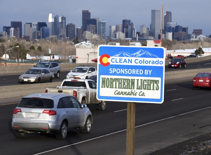 A Clean Colorado highway sign sponsored by the Northern Lights Cannabis Co. is displayed Feb. 6 on eastbound Sixth Avenue in Denver.