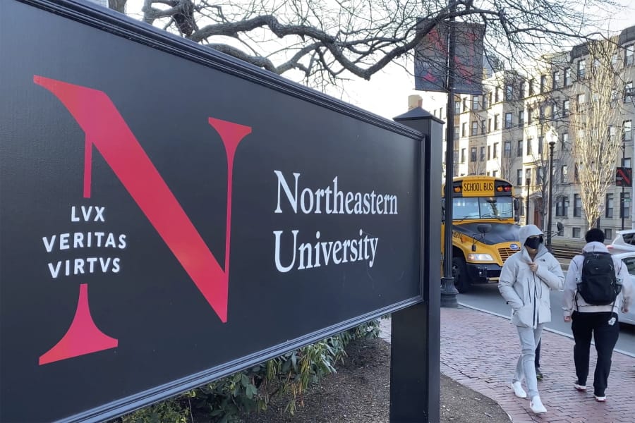 In this Jan. 31, 2019 photo, students walk on the Northeastern University campus in Boston. As concerns about China&#039;s virus outbreak spread, universities all over the world are scrambling to assess the risks to their programs.