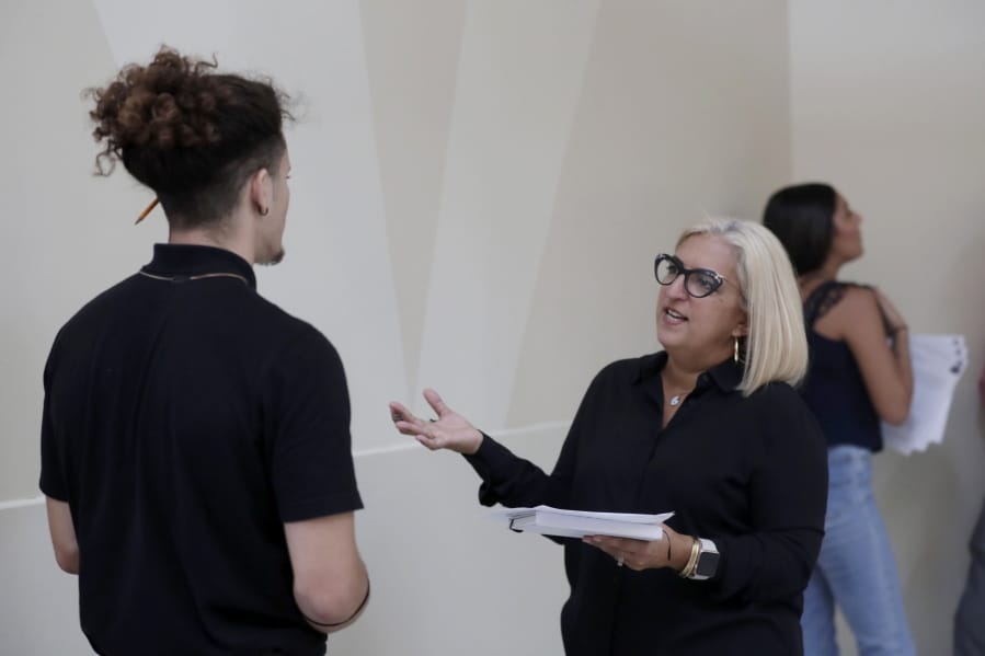 FILE - In this Oct. 1, 2019, file photo, Gory Rodriguez, of Starbucks, right, interviews a job applicant during a job fair at Dolphin Mall in Miami. The January U.S. jobs report on Friday, Feb. 7, 2020, may provide timely evidence of the U.S. economy&#039;s enduring health.