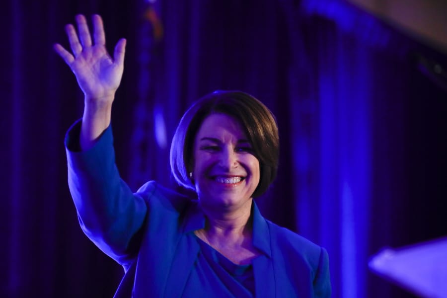 Democratic presidential candidate Sen. Amy Klobuchar, D-Minn walks onto the stage to speak at the First in the South Dinner, Monday, Feb. 24, 2020, in Charleston, S.C.