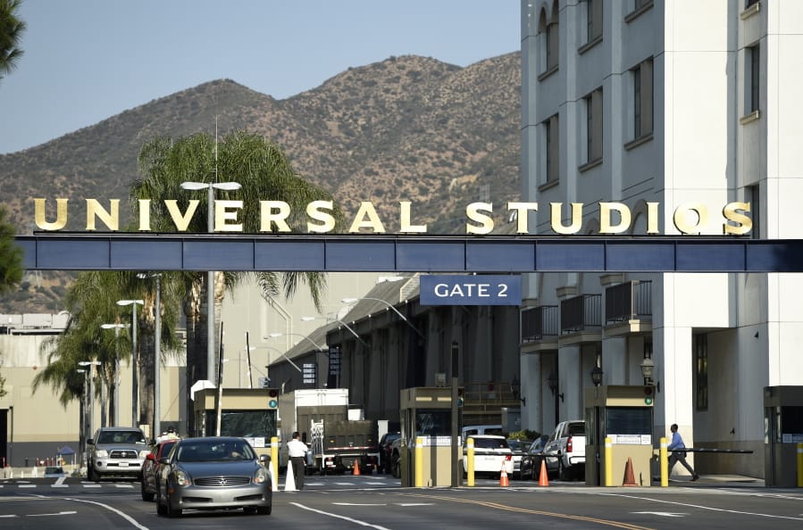 FILE - In this Aug. 23, 2016 file photo, the entrance to the Universal Studios lot is pictured in Universal City, Calif. A film built around the premise of liberal &quot;elites&quot; hunting people for sport in red states is coming to theaters in March, and the studio behind it is leaning into controversy about its premise. Universal Pictures on Tuesday, Feb. 11, 2020,  unveiled a trailer announcing &quot;The Hunt&quot; will be released March 13, roughly six months after it was supposed to have been released.