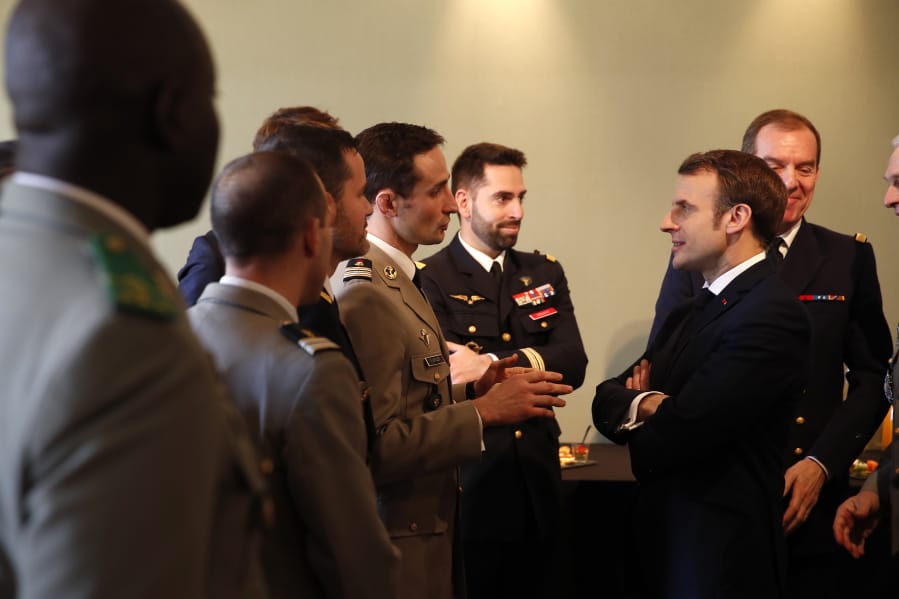 French President Emmanuel Macron, right, meets military officials at the Ecole Militaire Friday, Feb. 7, 2020 in Paris. French President Emmanuel Macron, who leads the European Union&#039;s only post-Brexit nuclear power, on Friday advocated a more coordinated EU defense strategy in which France, and its arsenal, would hold a central role.