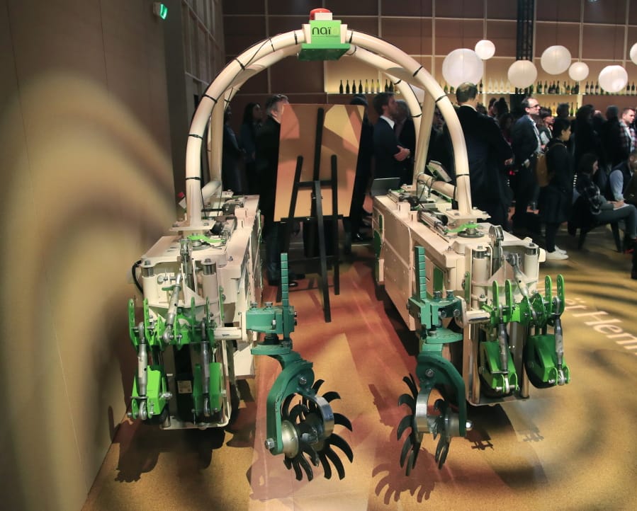 A weeding root machine is displayed Feb. 10 at the wine fair in Paris.
