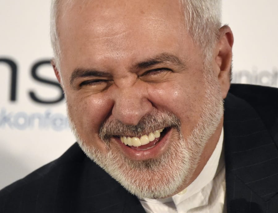 Iranian Foreign Minister Mohammad Javad Zarif laughs on the second day of the Munich Security Conference in Munich, Germany, Saturday, Feb. 15, 2020.
