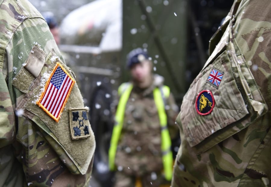A British and an United States soldier stand side by side after a press conference on the military exercise &#039;Defender 2020&#039; in Brueck, Germany, Wednesday, Feb. 26, 2020. The exercise with 37000 participants from a total of 18 nations will take place in Europe between January and about June 2020.