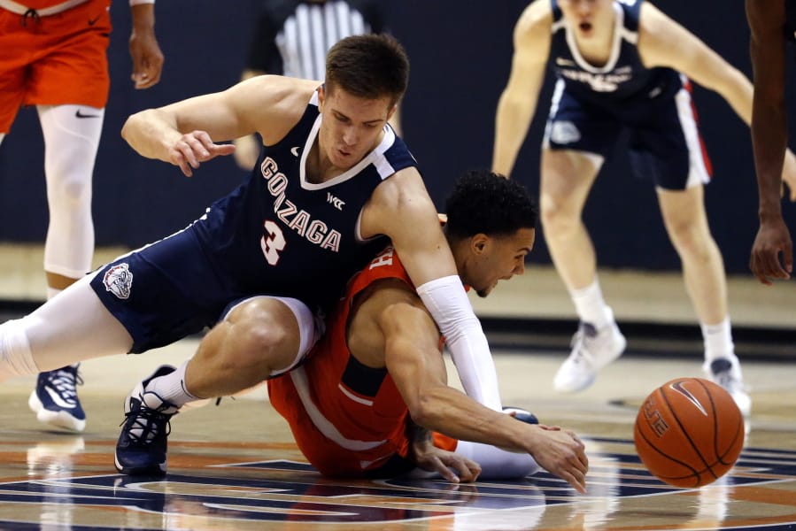 Gonzaga forward Filip Petrusev (3) collides with Pepperdine guard Keith Smith (11) during the first half of an NCAA college basketball game Saturday, Feb. 15, 2020, in Malibu, Calif. (AP Photo/Ringo H.W.
