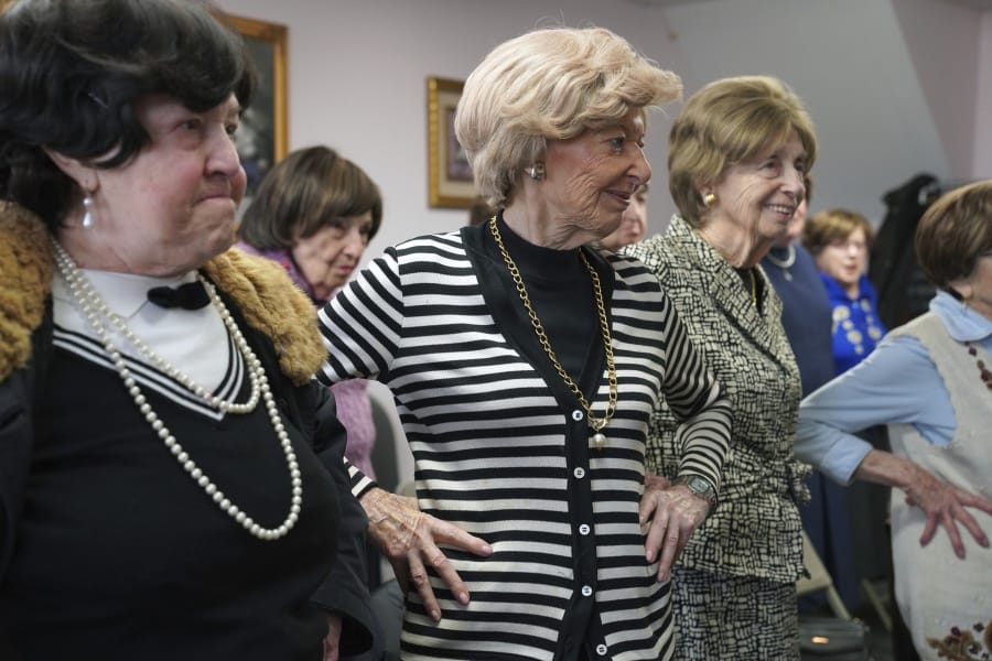 In this Jan. 22, 2020 photo, Dolly Rabinowitz, center, exercises with other Holocaust survivors at Nachas Health and Family Network in the Brooklyn borough New York. The community center provides survivors with meals, legal assistance, exercise classes and social events.
