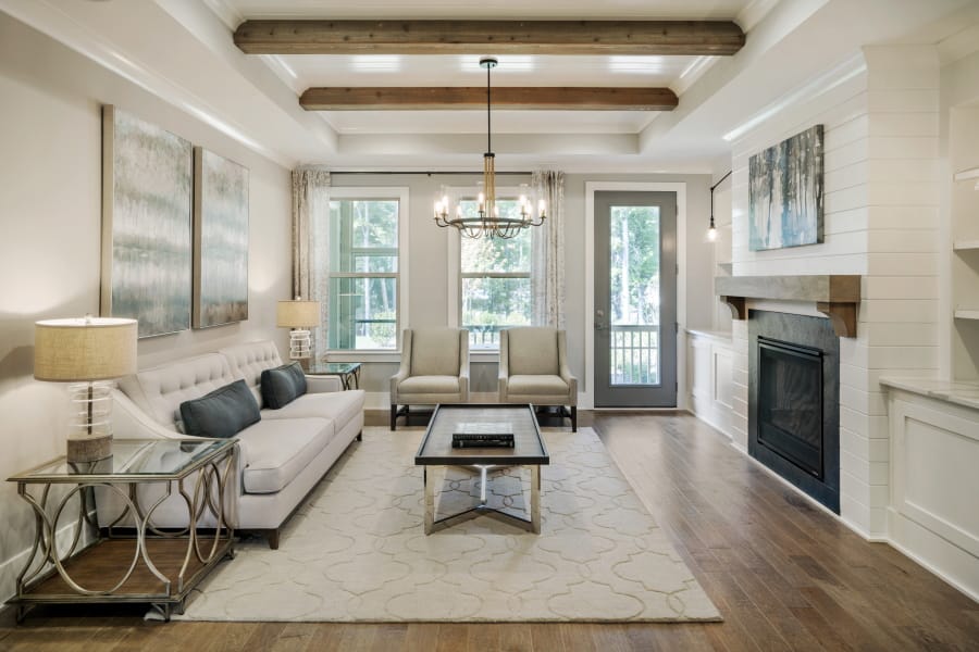 This photo provided by Ashton Woods shows a residential family room with natural wood beams as part of the ceiling in the Ashton Woods GlenPark community in Raleigh, N.C.