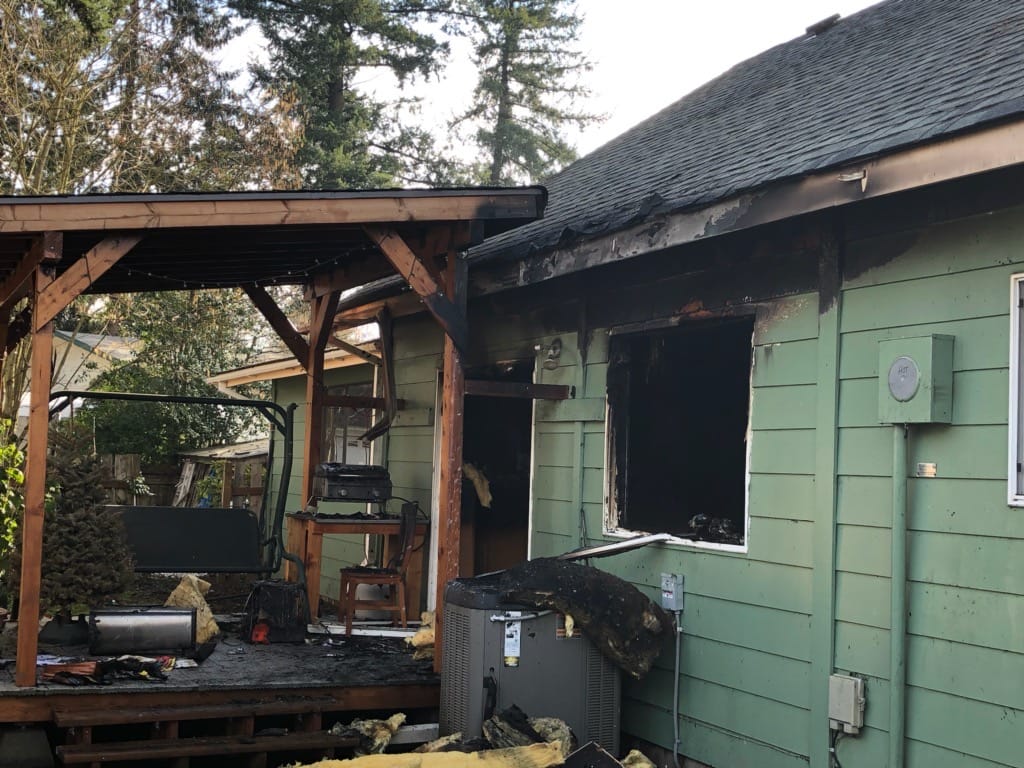 Firefighters rescued a dog from a burning house after responding to a report of a two-story house on fire at about 9 a.m. Saturday at 11020 N.E. 87th St.