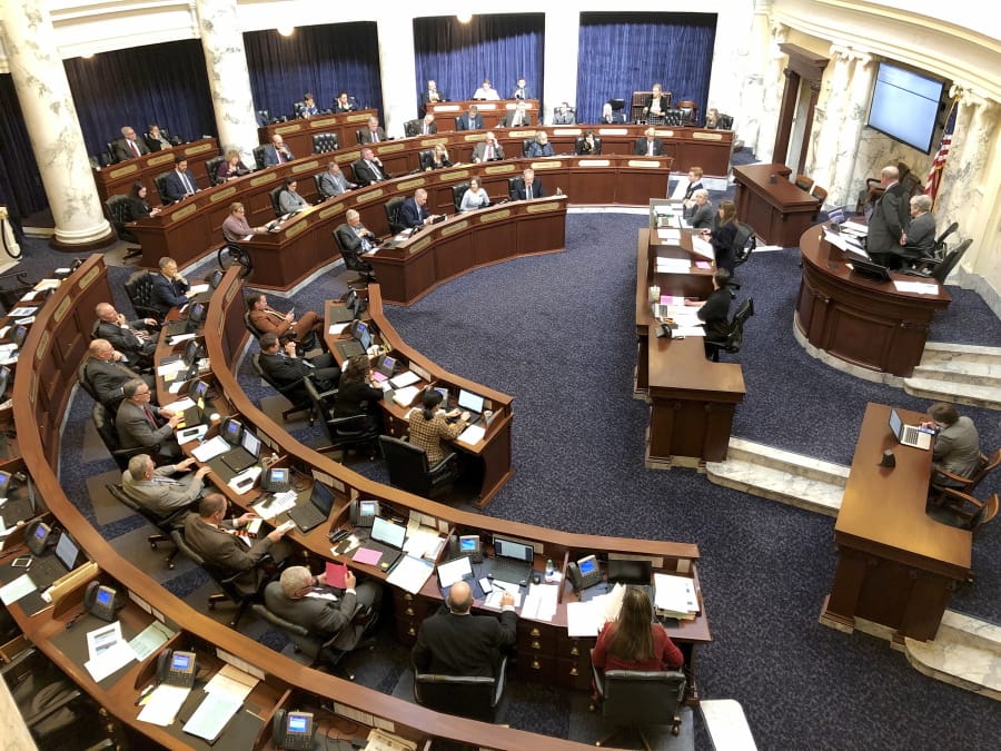 The Idaho House of Representatives debates legislation in the Idaho Statehouse in Boise, Idaho, Thursday, Feb. 27, 2020. Idaho lawmakers moved forward with legislation banning transgender people from changing the sex listed on their birth certificates despite a federal court ruling declaring such a ban unconstitutional.